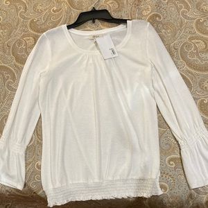Beautiful long sleeve shirt. Ivory in color.
